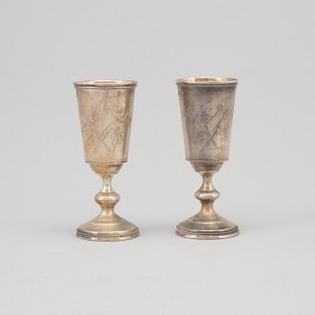 A pair of Russian parcel-gilt vodka cups, maker's mark cyrillic IB, St Petersburg, late 19th century.