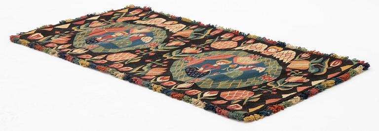 A carriage cushion, 'the Annunciation', tapestry weave, c. 100 x 48 cm, southwestern Scania, Sweden.