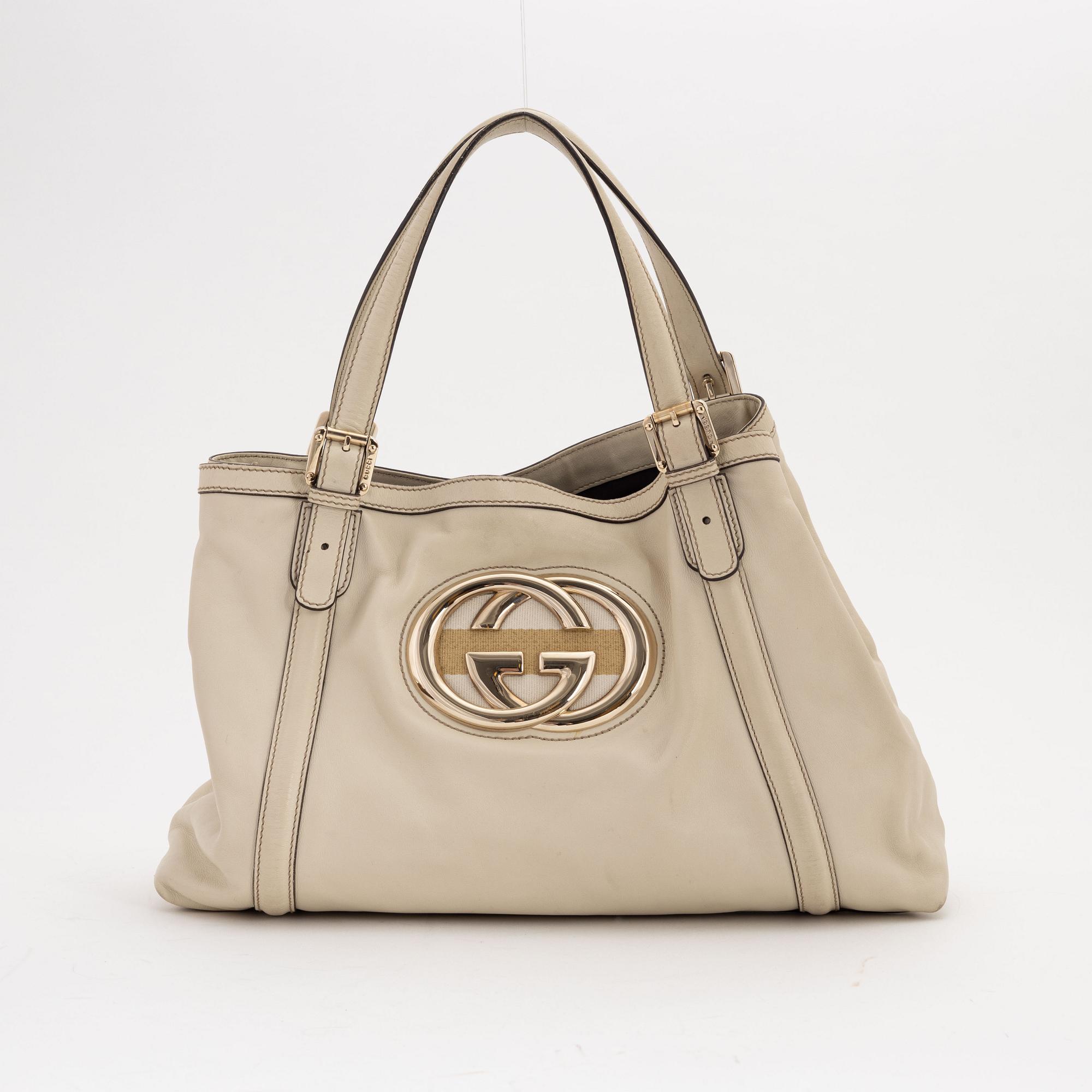Gucci, a cream leather handbag.