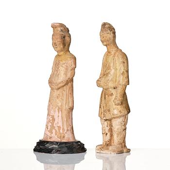 Two yellow glazed pottery figures, Tang/Sui dynasty.