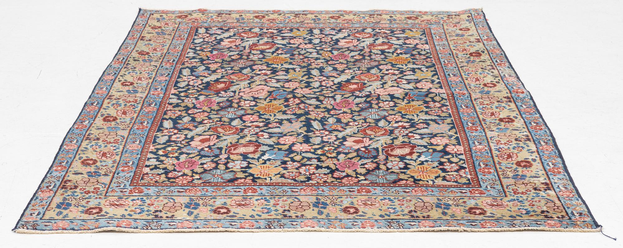 A rug, possibly Tabriz, c. 195 x 137 cm.