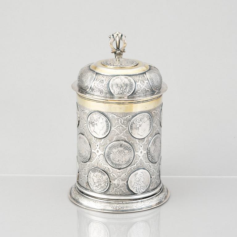 A German 18th century parcel-gilt silver coin-tankard, mark of Johann Friedrich Beyer, Schweidnitz (1736-1775).