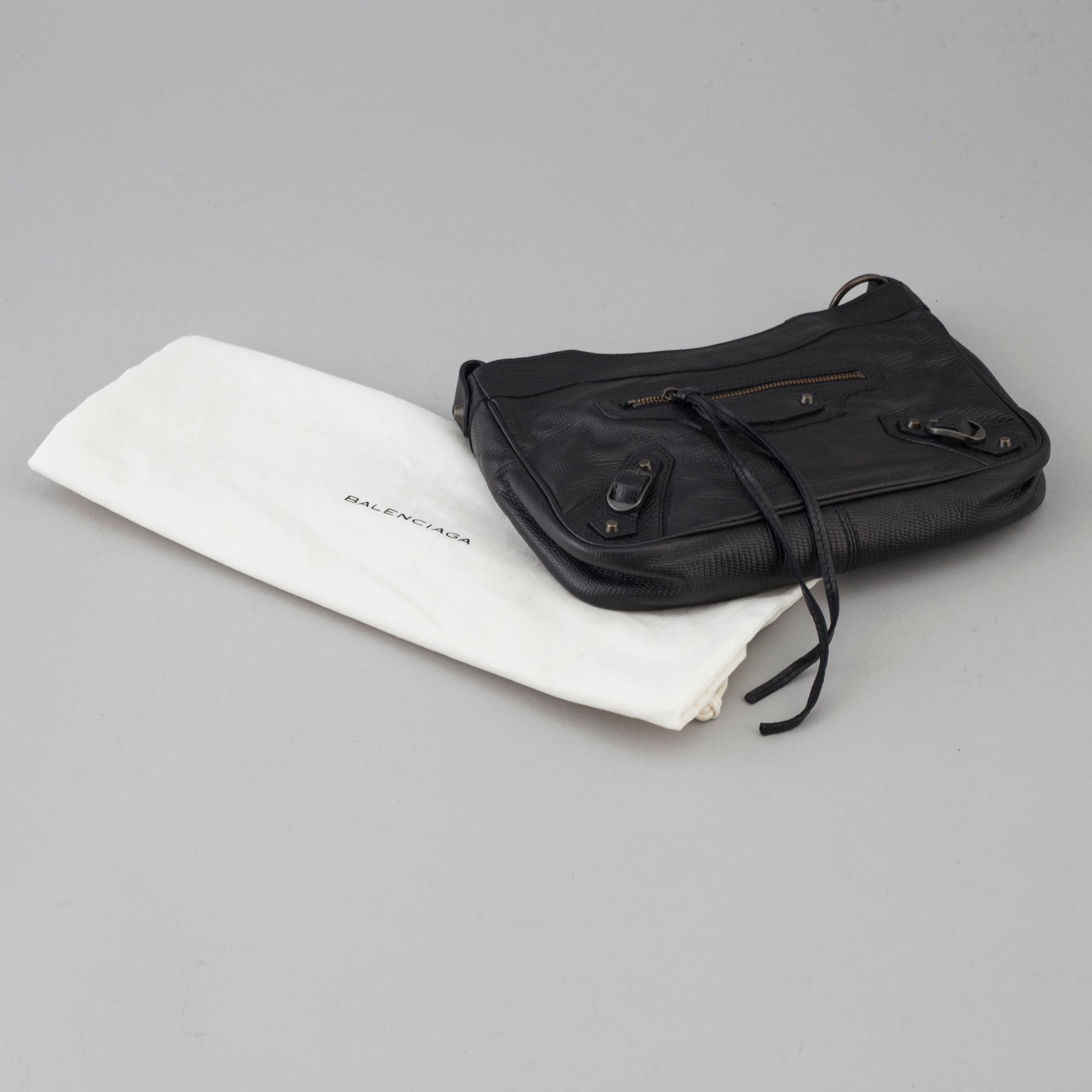 A black alligator printed leather Classic hip bag by Balenciaga. Bukowskis