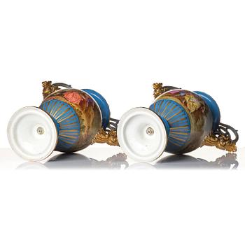 A pair of large porcelain urns, Sèvres like mark, around 1900.