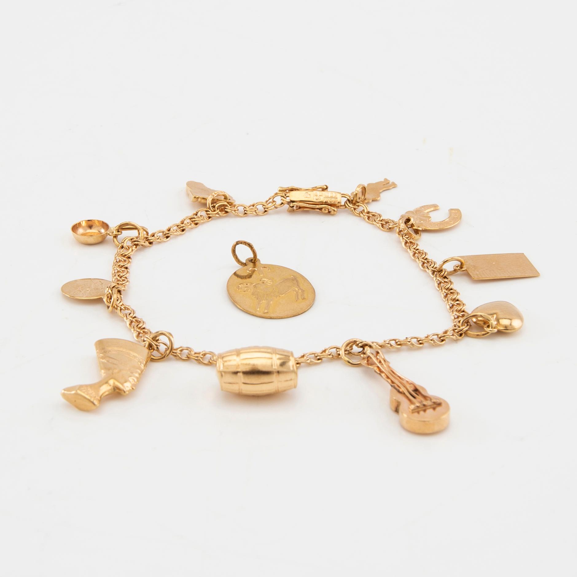 Armband Bismarck-länk 18K guld med berlocker.