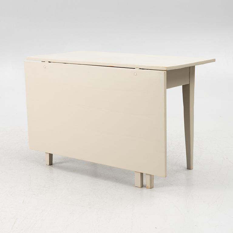 A drop-leaf table, late 19th century.