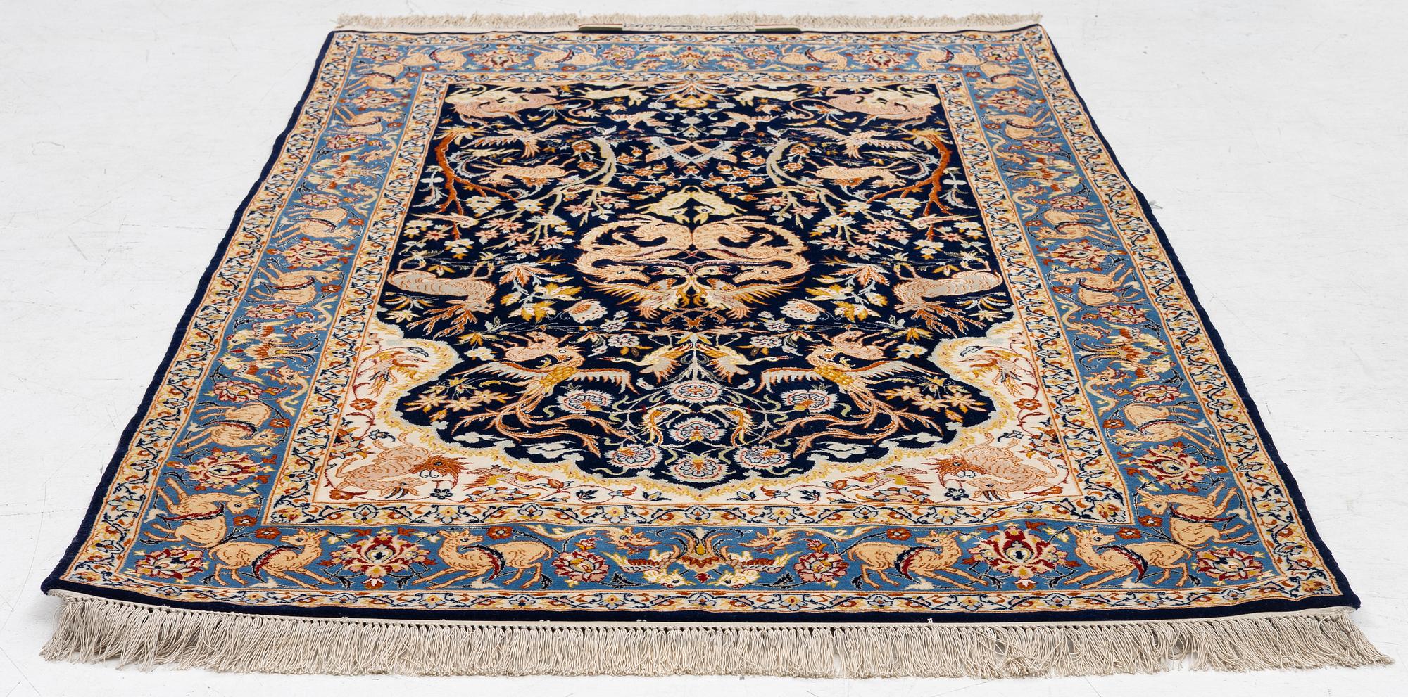 A semi-antique part silk Isfahan, signed, c. 176 x 107 cm.