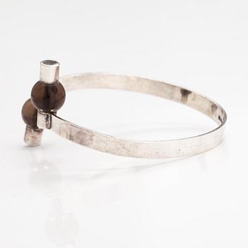 Elis Kauppi, A sterling silver bracelet with smoaky quartz pearls. Kupittaan kulta, Turku.