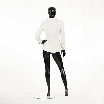 CHANEL, a white bouclé jacket.