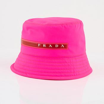Prada, a neon pink bucket hat.