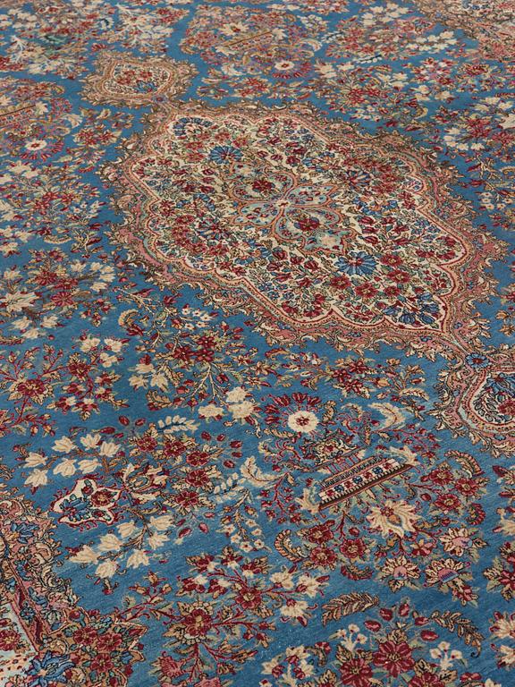 A semi-antique Kerman carpet,  440 x 296 cm.