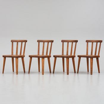 Axel Einar Hjorth, a set of four stained pine "Utö" chairs, Nordiska Kompaniet, Sweden 1930s.