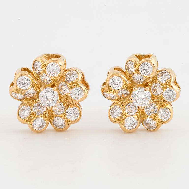 Brilliant-cut diamond flower earrings.