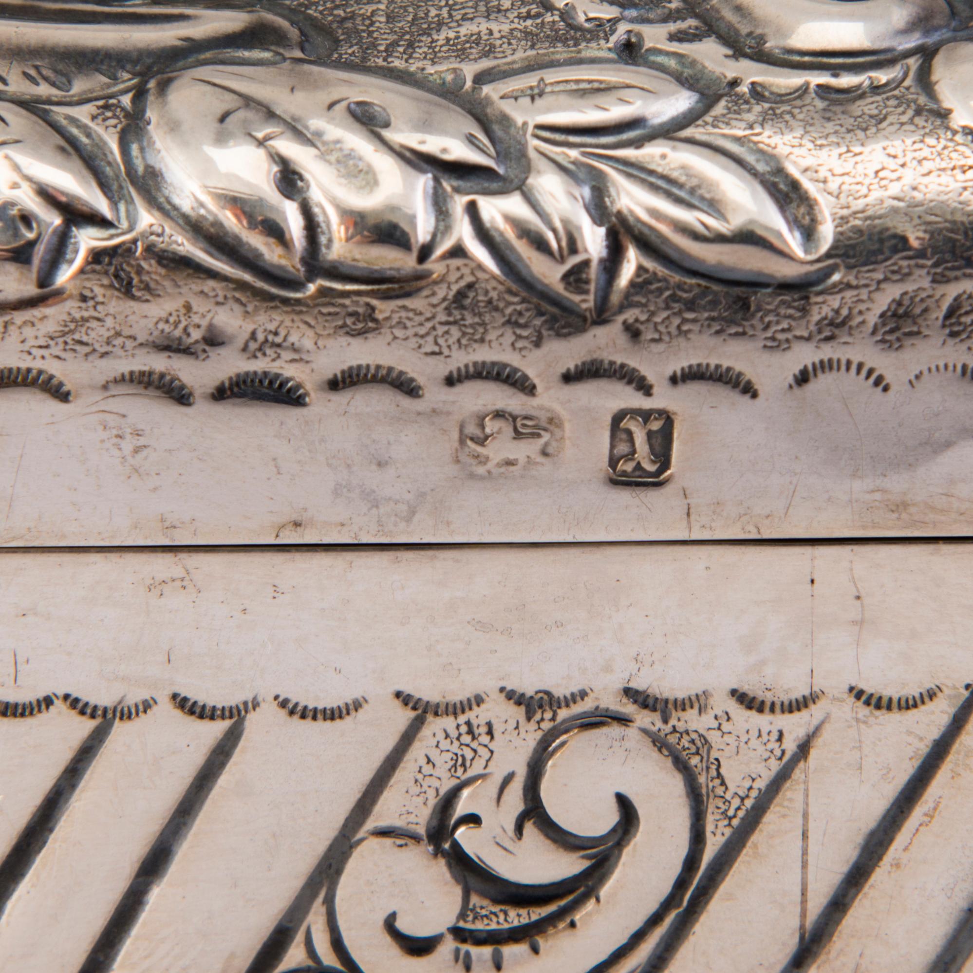 A silver cigar box, mark of A. & J. Zimmerman, Birmingham 1897.