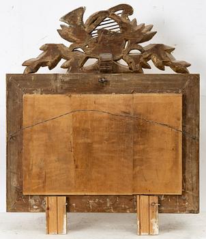 A gilt-gesso two-branch Empire girandole mirror, first part 19th century.