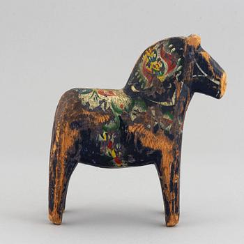 A set of 4 painted wooden horses from the first half of the 20th century.
