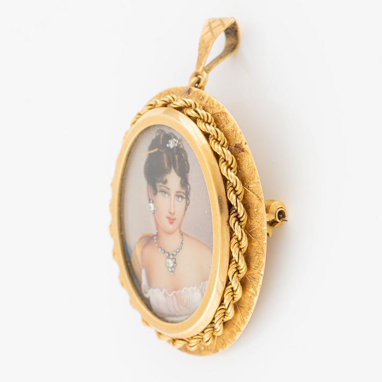 Pendant/brooch in 18K gold with a lady's portrait.