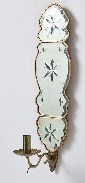 A pair of Swedish late Baroque one-branch girandole mirrors, mid 18th century.