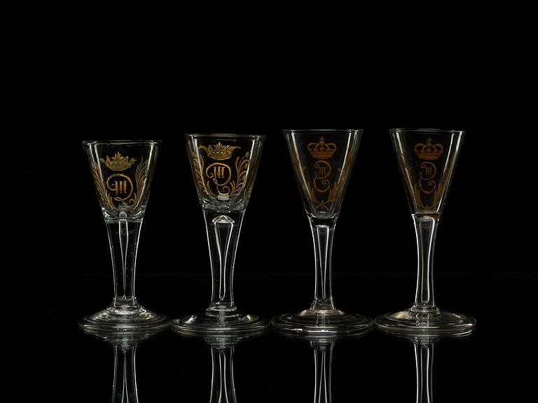 A set of four armorial wine goblets, 18th Century.