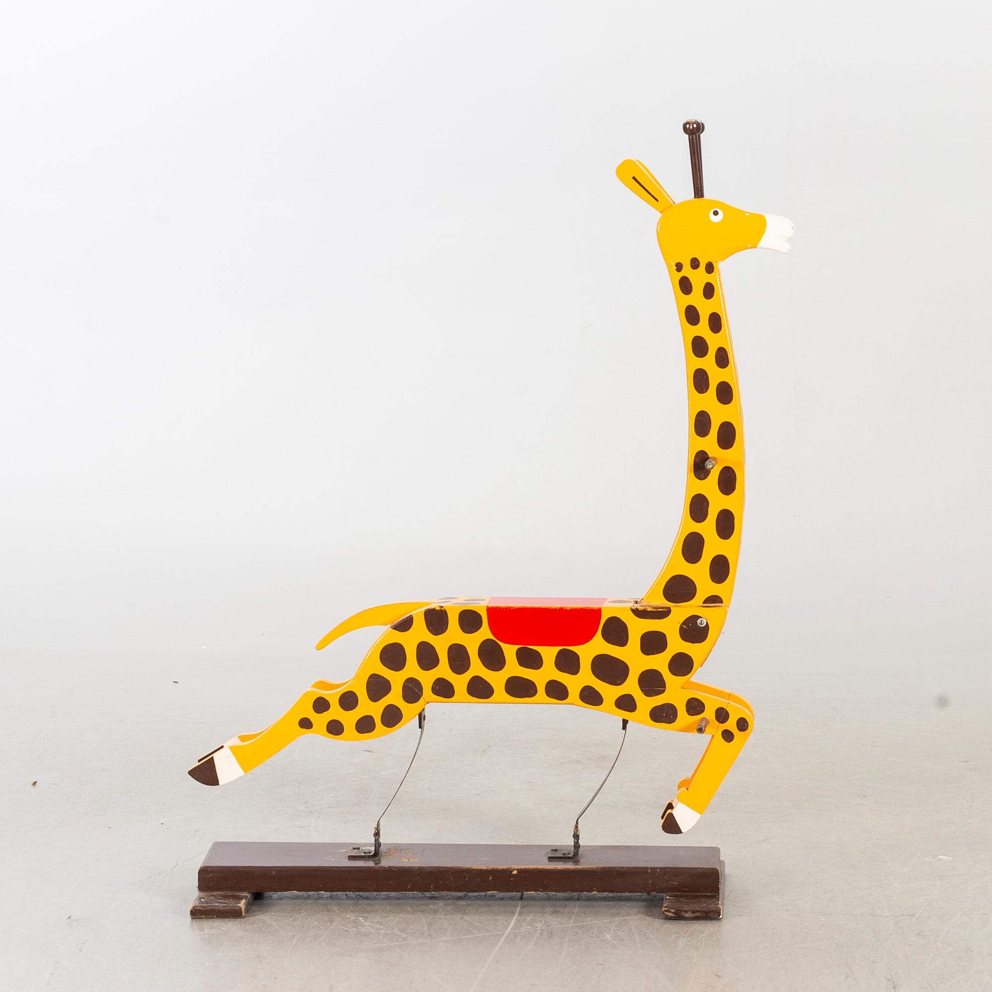 A second half of the 20th century rocking giraffe.
