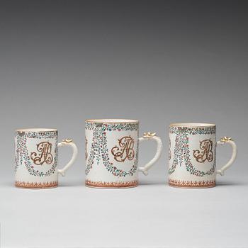 A group of three famille rose armorial jugs, Qing dynasty, Qianlong (1736-95).