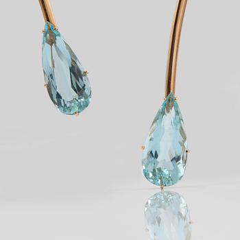 A necklace with two pear-shaped aquamarines.