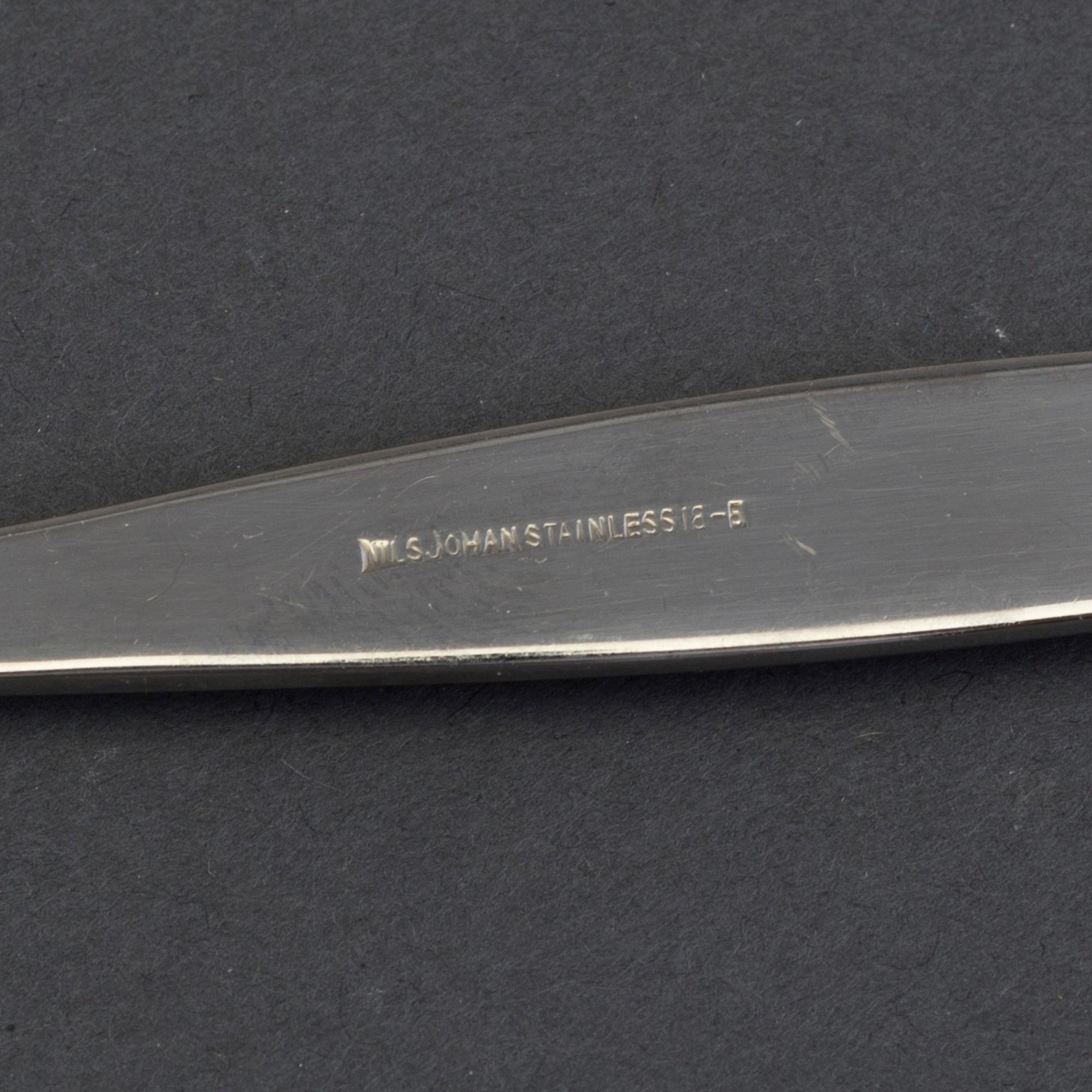 A set of 40 pieces "Guldi" stainless steel flatware, "Norse" decoration in gold, Nils Johan, Sweden, mid 20th century.