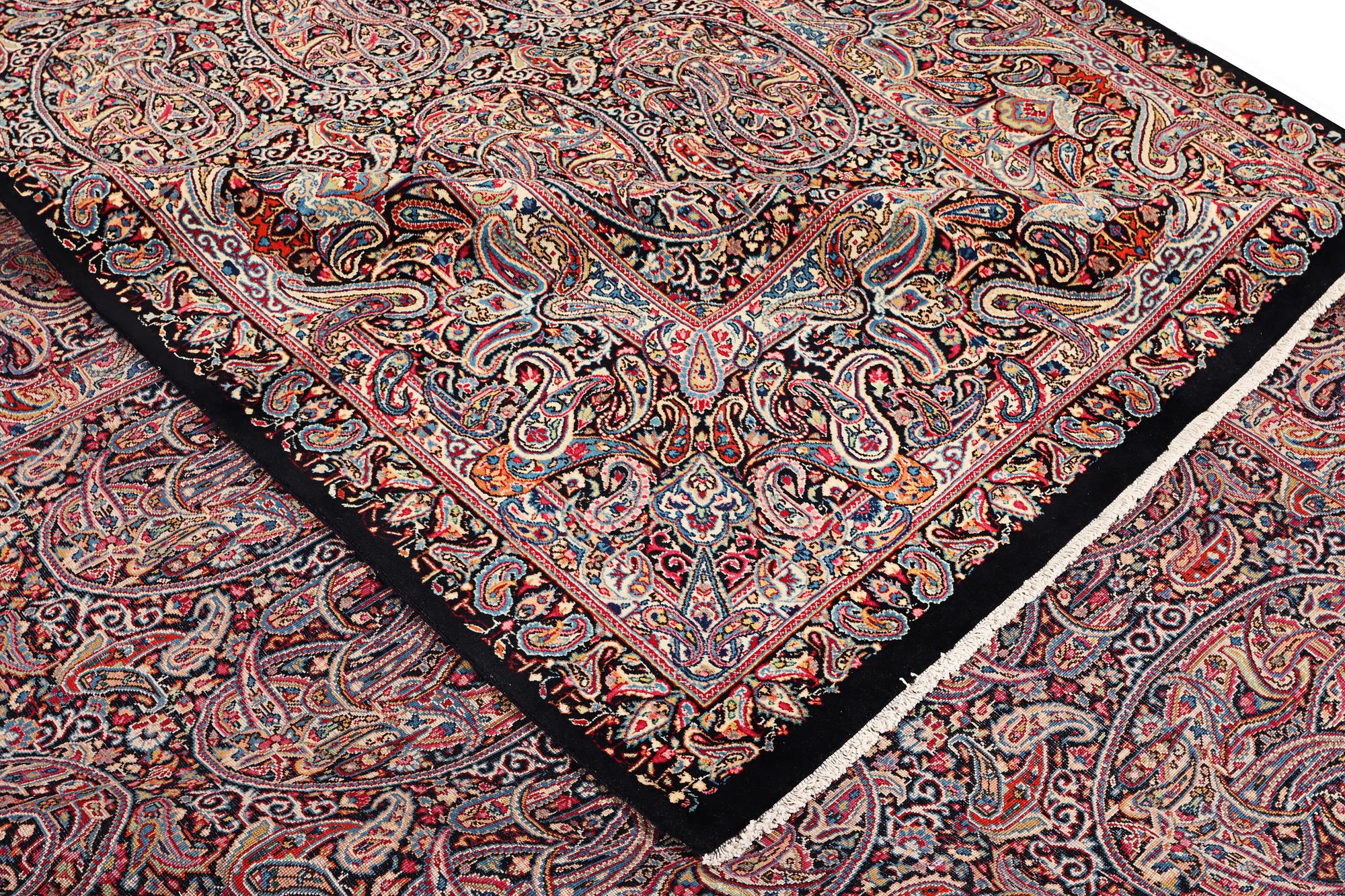 A Boteh pattern Kerman carpet, c. 475 x 342 cm.