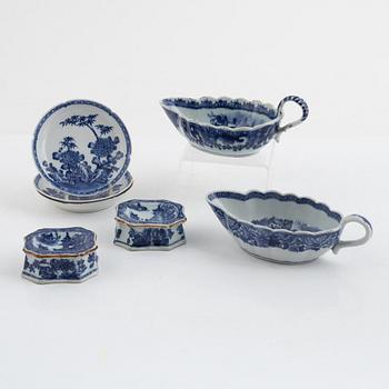 Two Chinese blue and white porcelain sauce boats and a pair of salts, also three small dishes, Qing dynasty, 18th centur.