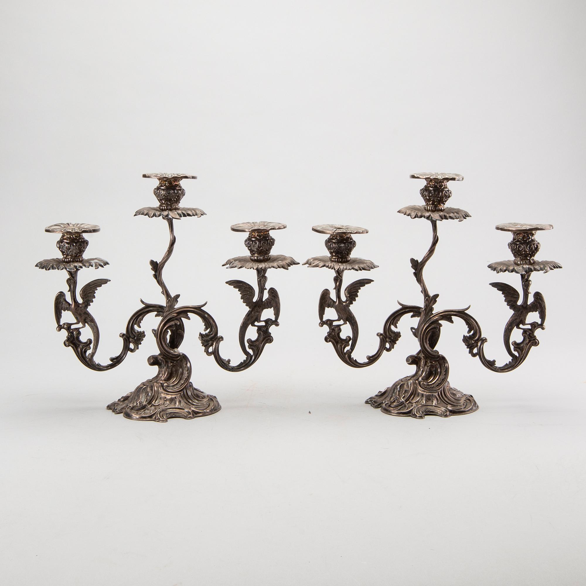 A pair of Swedish silver candelabra mark of GUSTAF MÖLLENBORG Stockholm 1846 , total weight ca 4420 gr, height 31 cm.