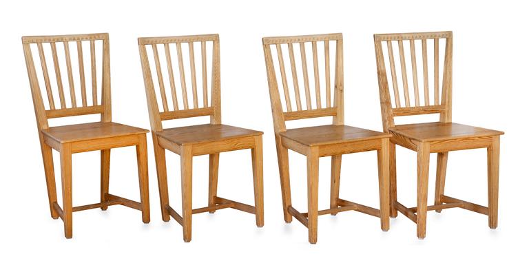 A SET OF FOUR PINE CHAIRS,