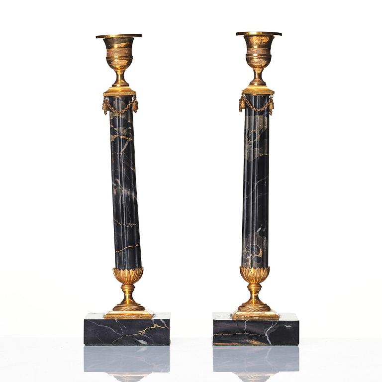 A pair of late Gustavian Portor marble candlesticks, late 18th century.