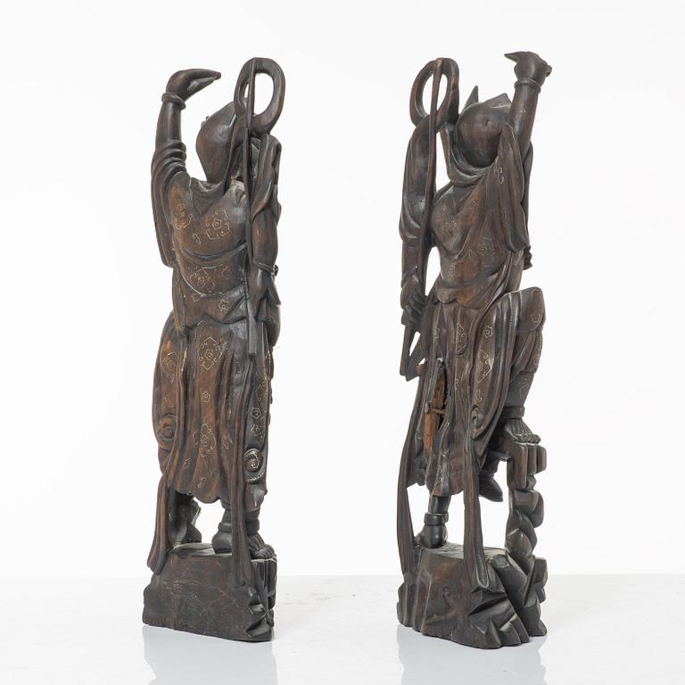 A pair of Chinese hardwood figures, 20th century.