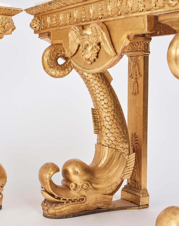 A pair of Swedish Empire carved and giltwood console tables, first half of the 19th century.