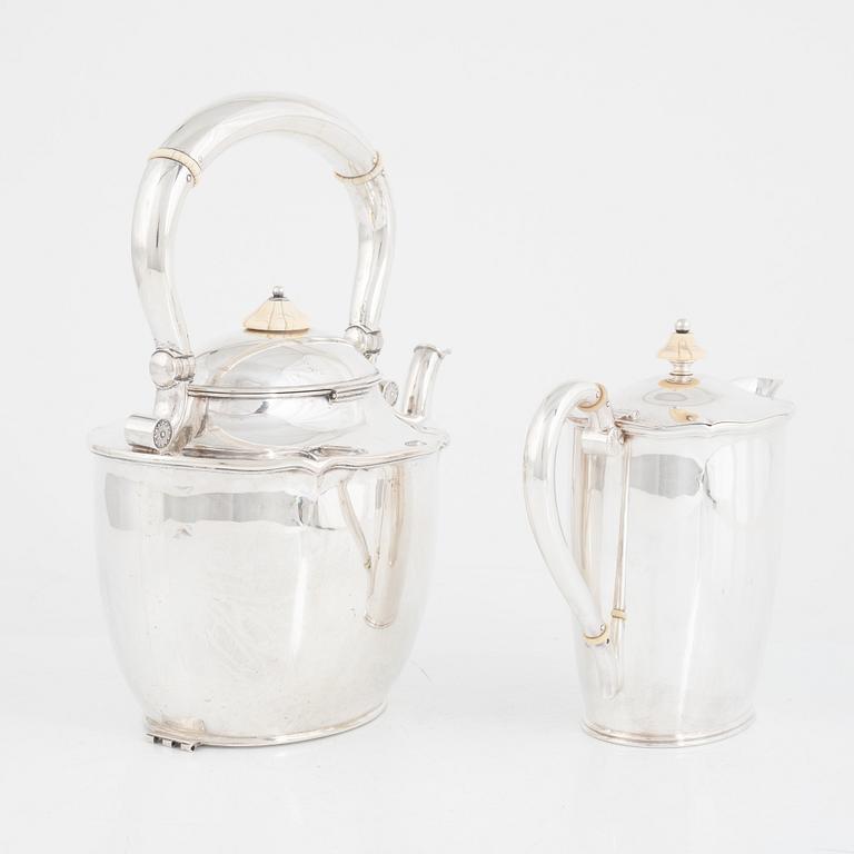 A silver teapot, mark of CG Hallberg, Stockholm 1919 and silver a milk jug, Edlunds silvervarufabrik, Stockholm 1937.