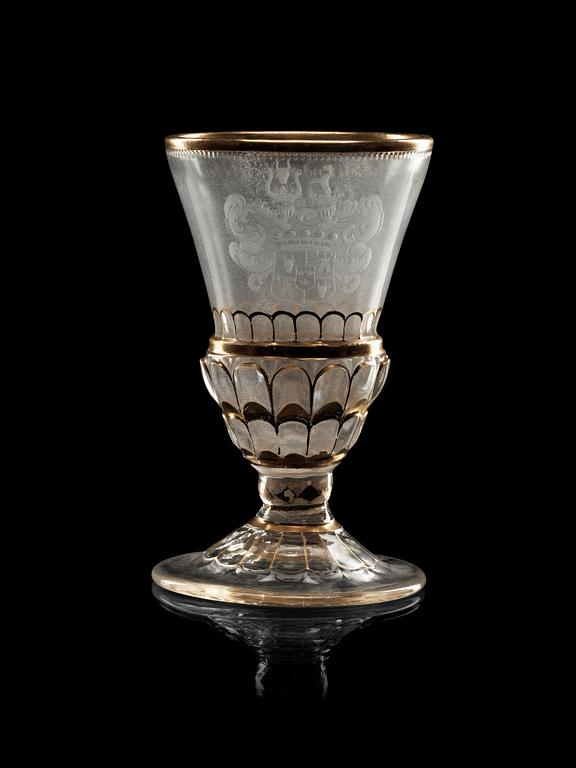 A cut, engraved and gilded armorial goblet, 18th Century.
