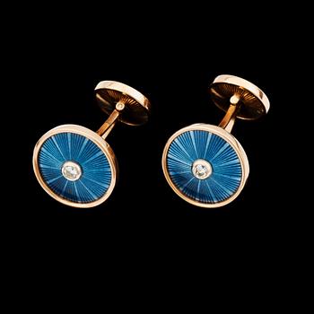 A pair of blue enamel and diamond cufflinks.