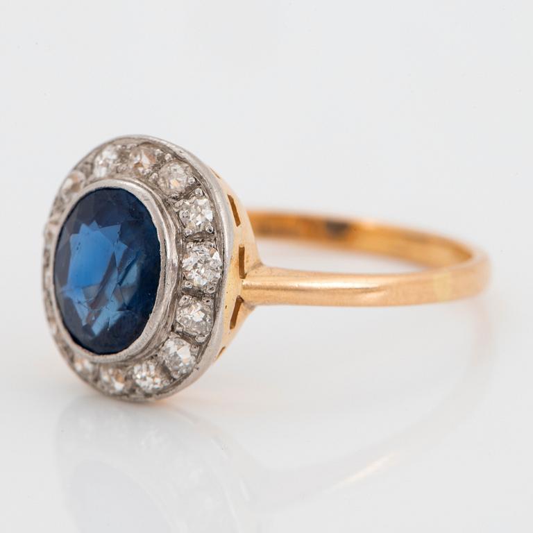 An 18K gold ring set with a faceted sapphire weight ca 2.00 cts and old-cut diamonds.