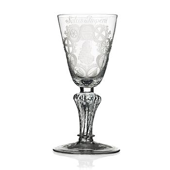 239. An engraved German glass goblet, 18th Century.