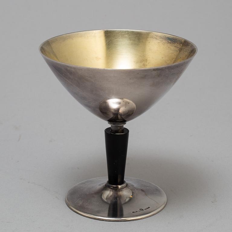 FOLKE ARSTRÖM, a silver plated cocktail shaker and eight glasses from GAB.