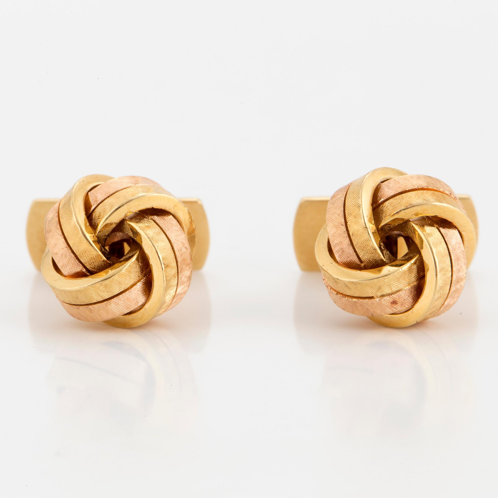 A pair of 18K two colour gold cufflinks.