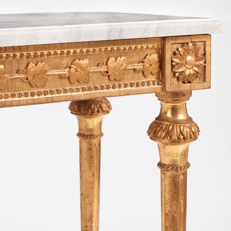 A Gustavian carved giltwood and marble console by O. C. Lindmark (master in Stockholm 1779-1813).