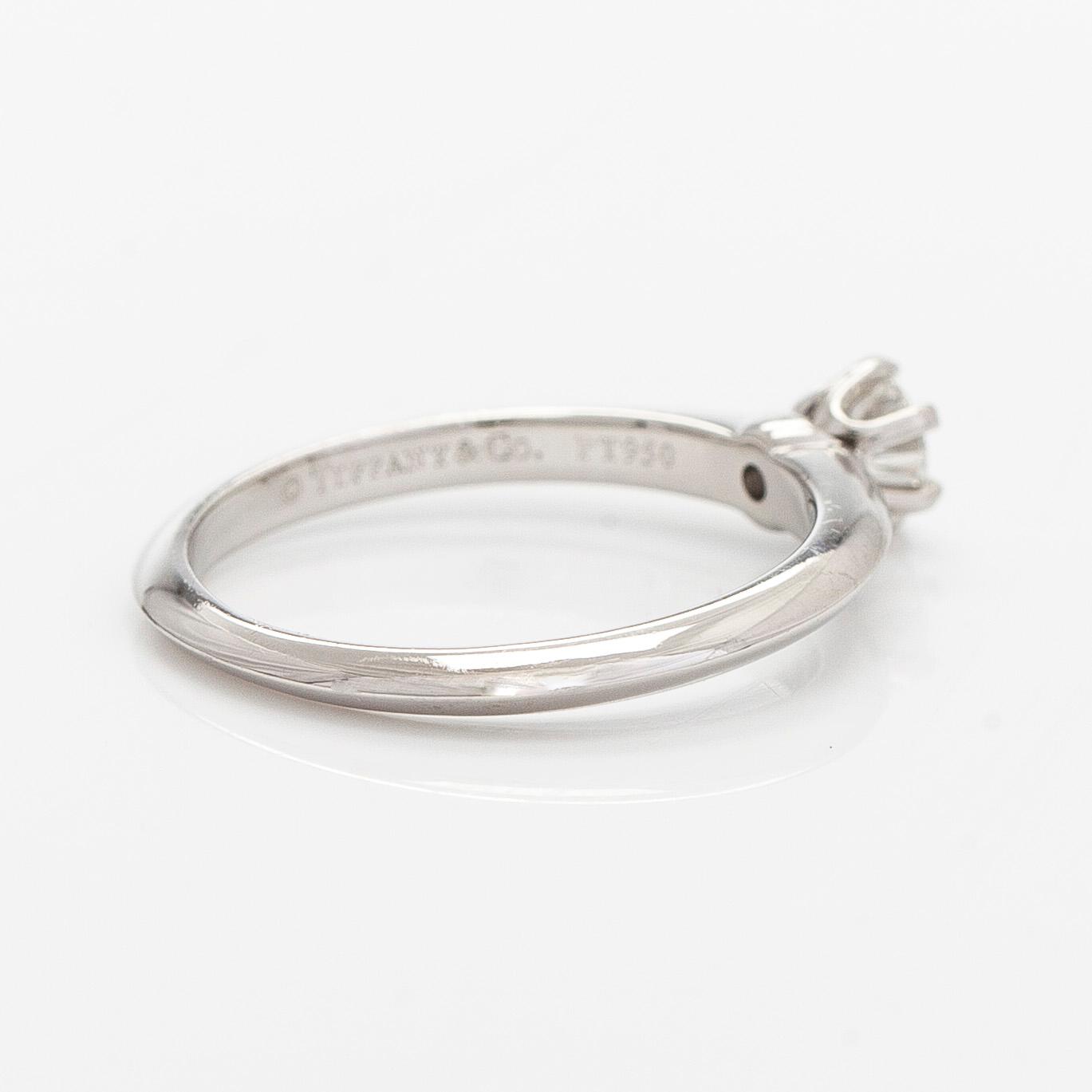 Tiffany & Co, a platinum solitaire ring with a brilliant-cut diamond.