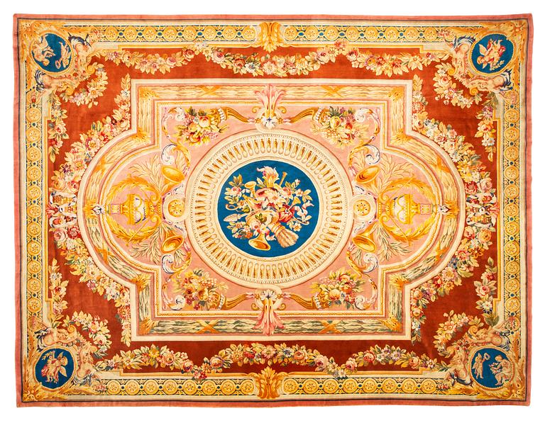 A carpet in savonnerie technique, ca 560 x 429 cm, Louis XVI style.