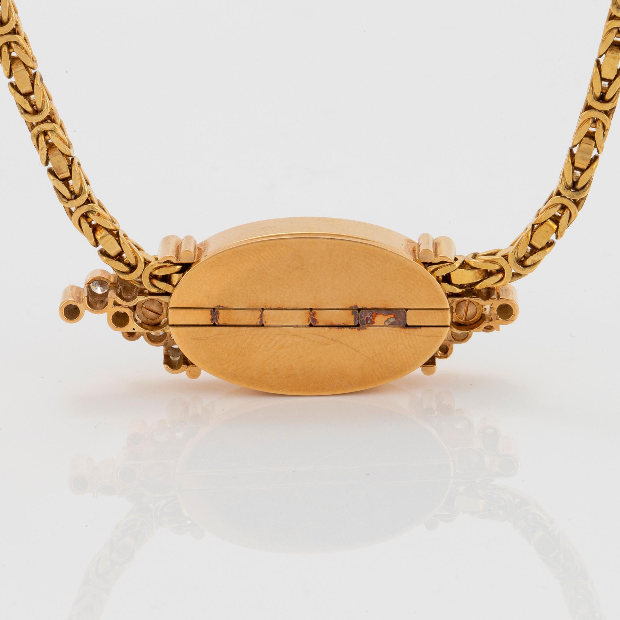 Hängsmycke 18K guld med en opal och runda briljantslipade diamanter.