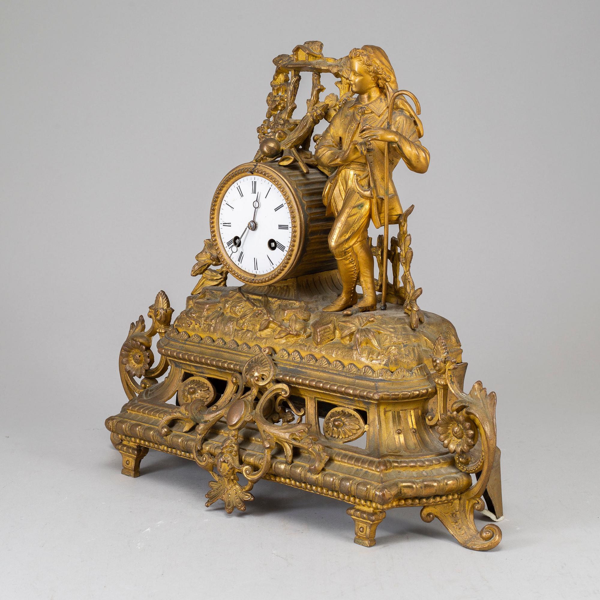 A  19th/20th century mantle clock in Louis-XVI style.