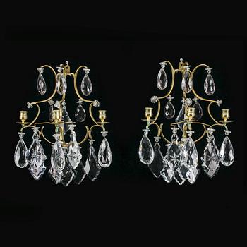 VÄGGLAMPETTER, ett par, rokokostil, omkr år 1900.