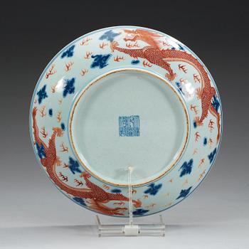 A blue and white and red overglaze dragon dish, presumably Republic with mark in underglaze blue.