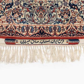 A semi-antique Isfahan rug, signed (Sadegh) Seirafian, c. 244 x 149 cm.