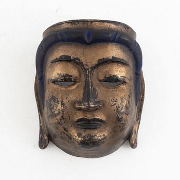 A lacquered wooden mask, 20th century.